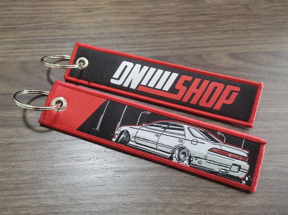 Car keychain/key ring embroidered nylon car accessories, black and red, suitable for Nissan .