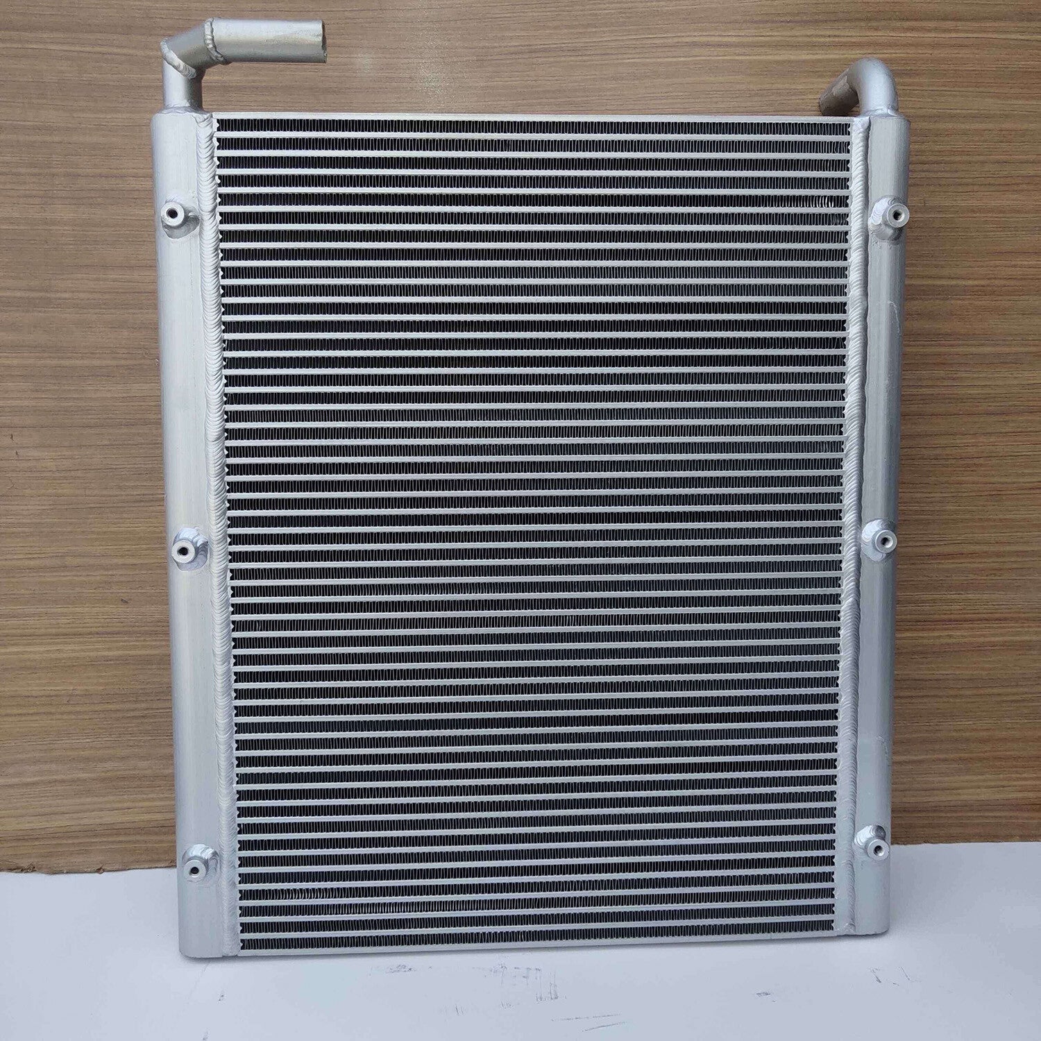 The 12452U413S7 oil cooler is suitable for Kobelco excavators SK100, SK100-1, SK100-3, and SK120-1.