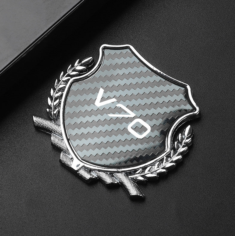 Carbon-plated side fender and window badge stickers for Volvo C70 cars.